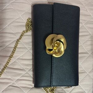Black and Gold Clutch with Circular Embellishment